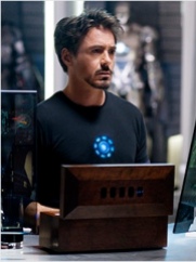 Tony Stark listens as J.A.R.V.I.S updates him on his Palladium poisoning status.